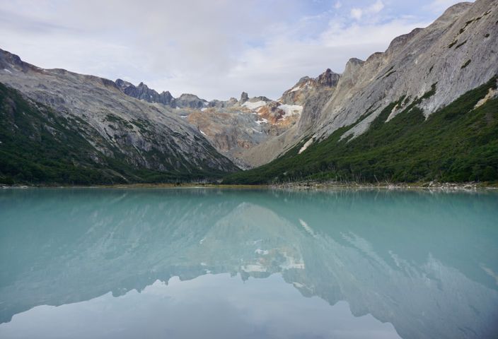 A tranquil view of a mountain lake with reflections in Ushuaia, Patagonia.