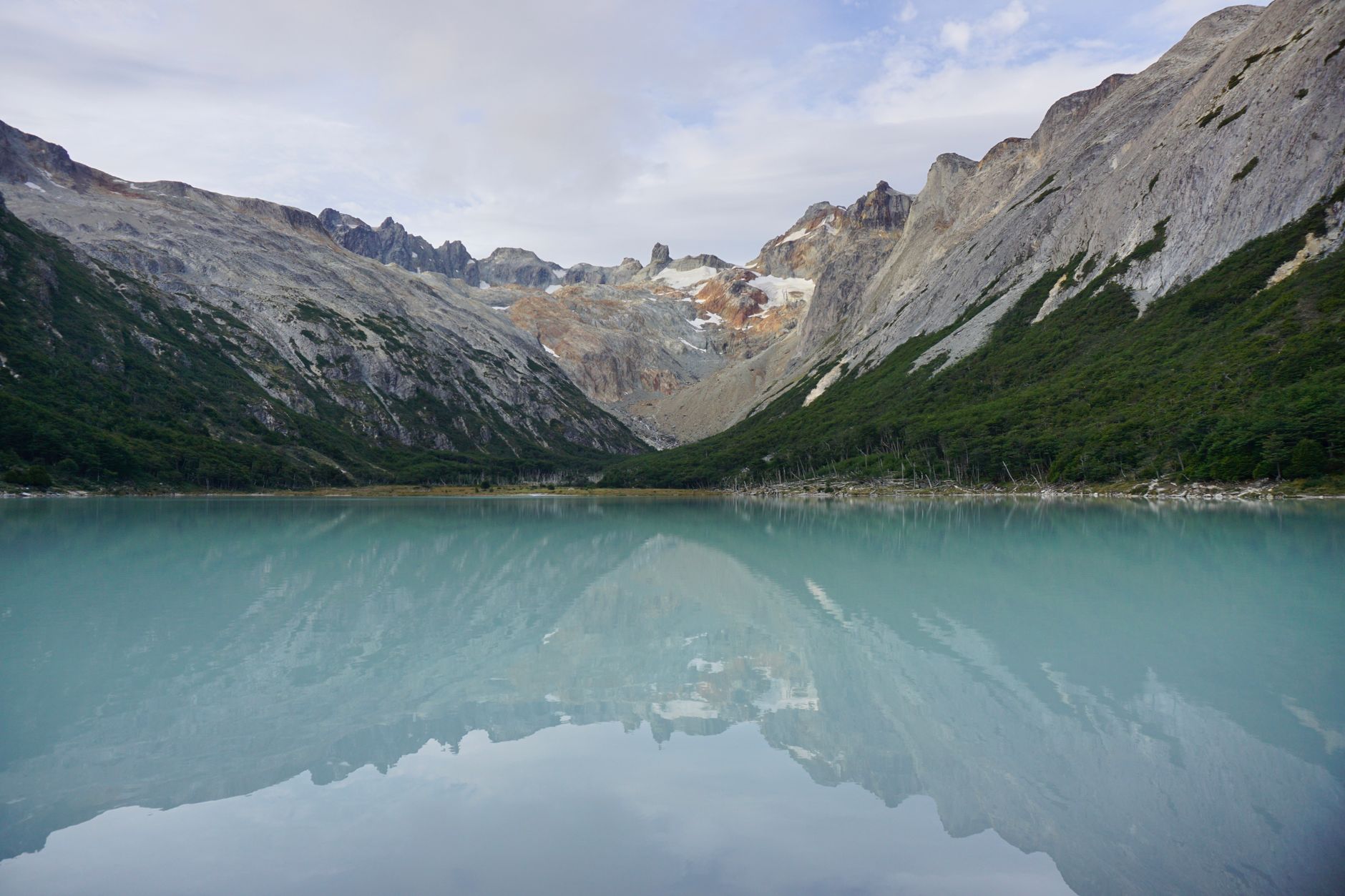 A tranquil view of a mountain lake with reflections in Ushuaia, Patagonia.