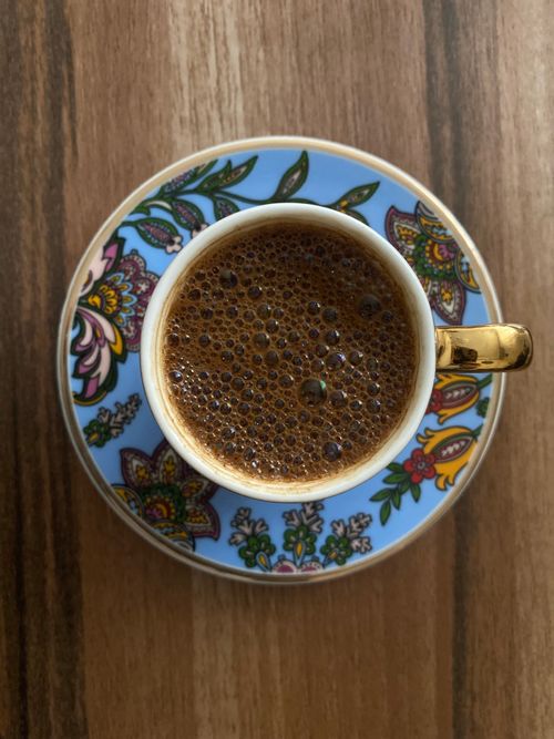 Free Top view of Turkish coffee in a floral cup, showcasing rich texture. Stock Photo