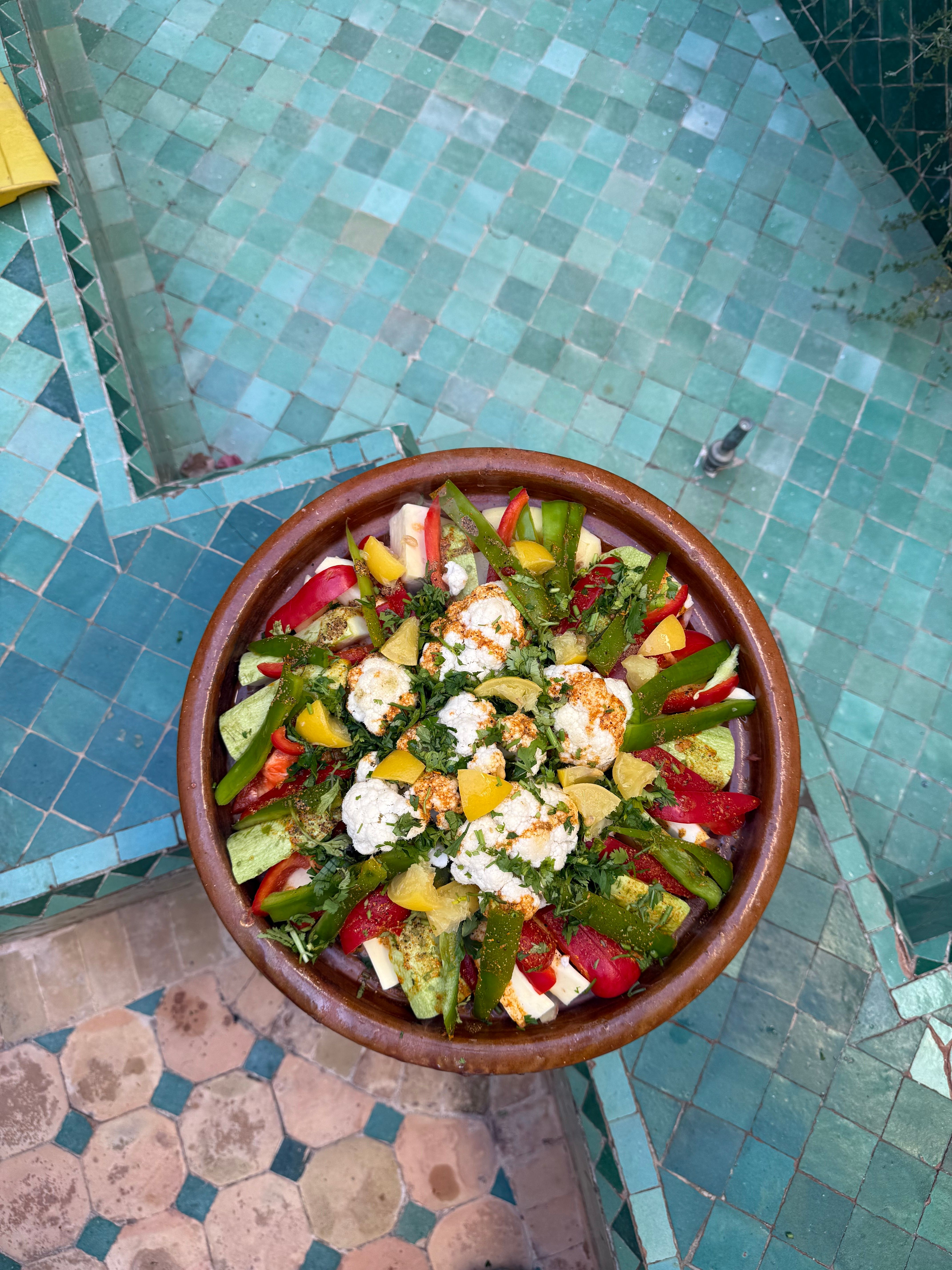 A vibrant display of Moroccan spices in a market setting.