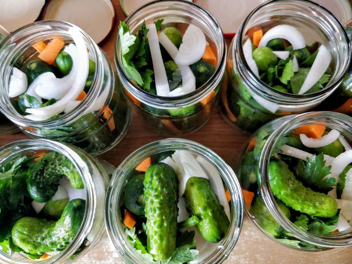 Glass jars of vegetables ready for pickling
