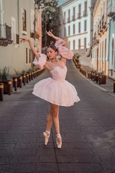 Graceful ballet dancer performs in scenic street of Puebla, Mexico.