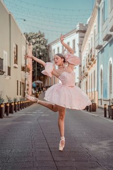 Graceful ballet dancer performs on a picturesque street in Puebla, Mexico.