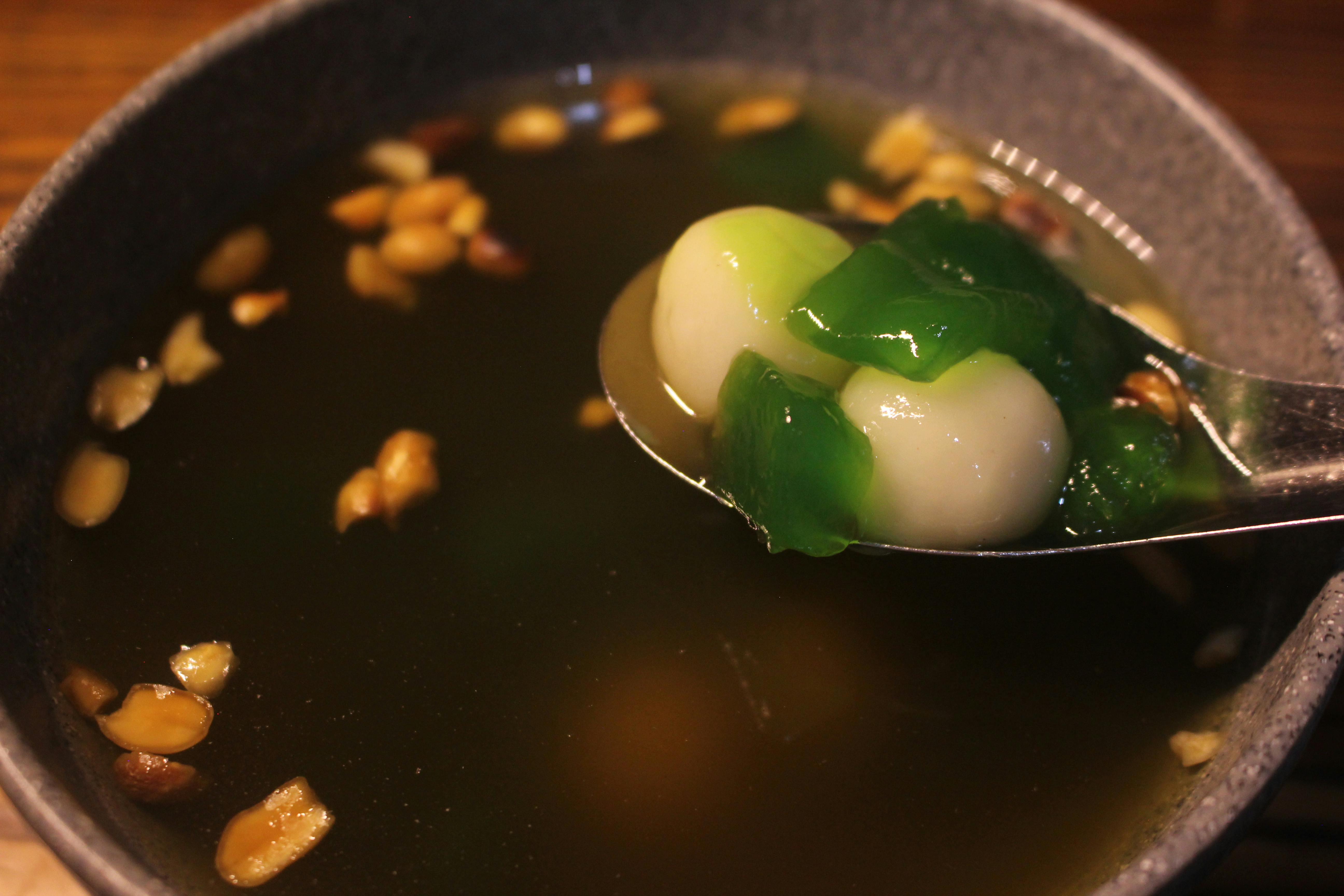 Delicious Korean sweet rice dumplings in broth with nuts. Perfect for traditional cuisine concepts.