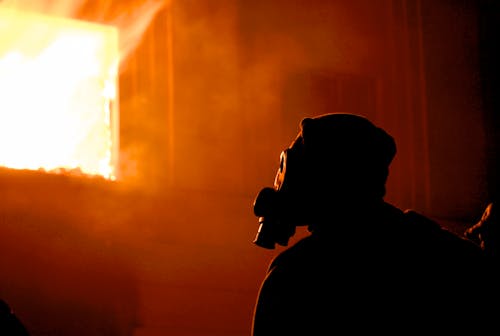 Silhouette of Man Wearing Helmet and Goggles