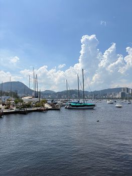 Picturesque scene of Guanabara Bay with sailboats under a clear blue sky in Rio de Janeiro.