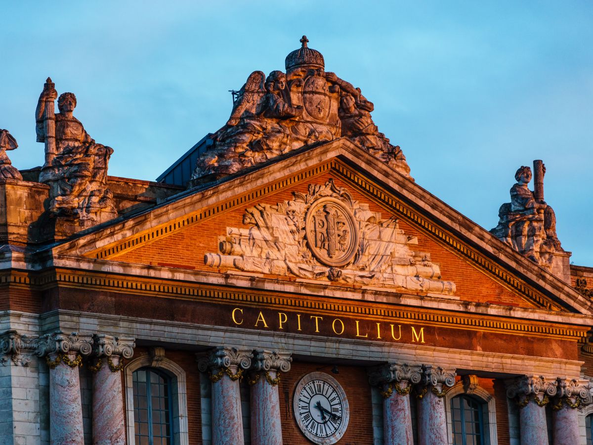 The pink-brick Capitole of Toulouse at golden hour