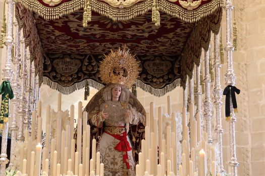 Captivating image of a religious procession in El Puerto de Santa María, depicting Semana Santa traditions.
