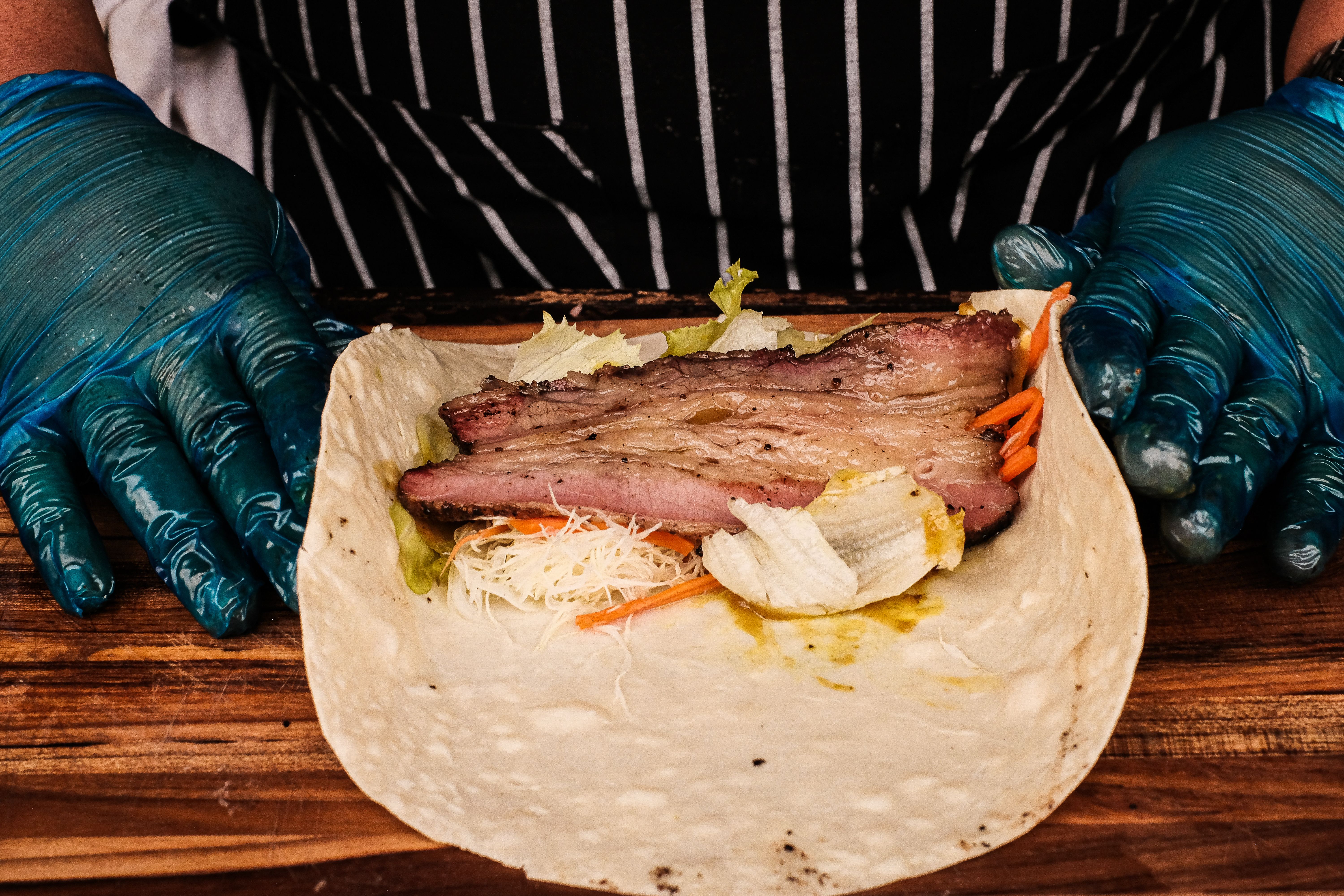 Close-up of pork shoulder cooking with spices