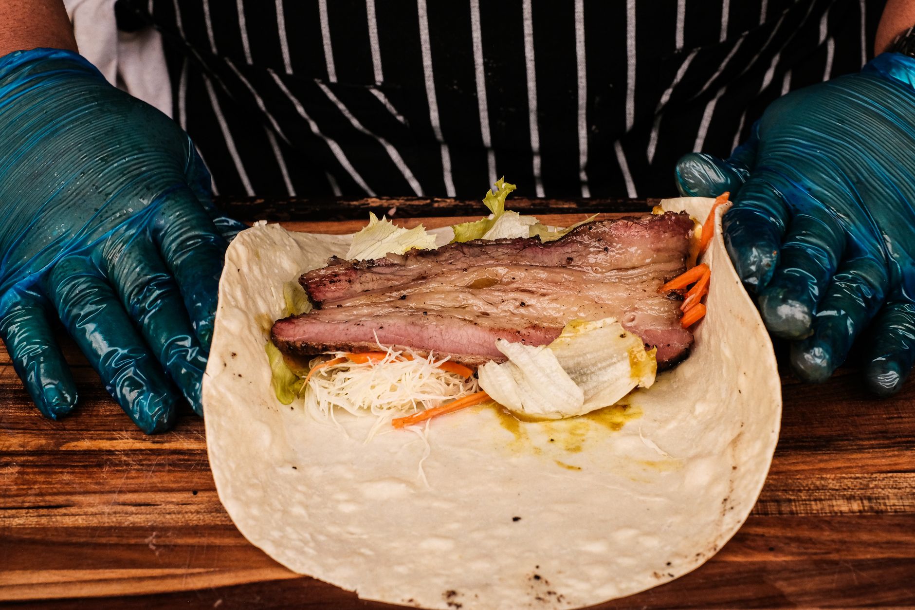 Close-up of pork shoulder cooking with spices