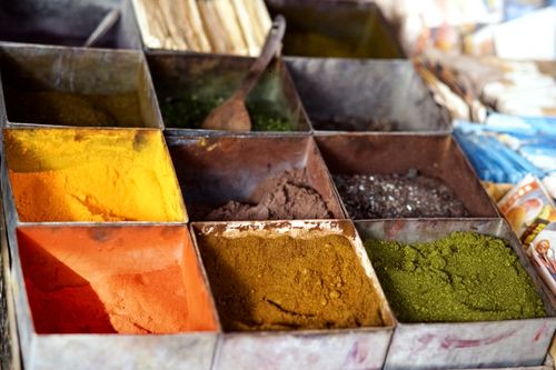 Free A vibrant display of spices in a traditional Pakistani market stall. Stock Photo
