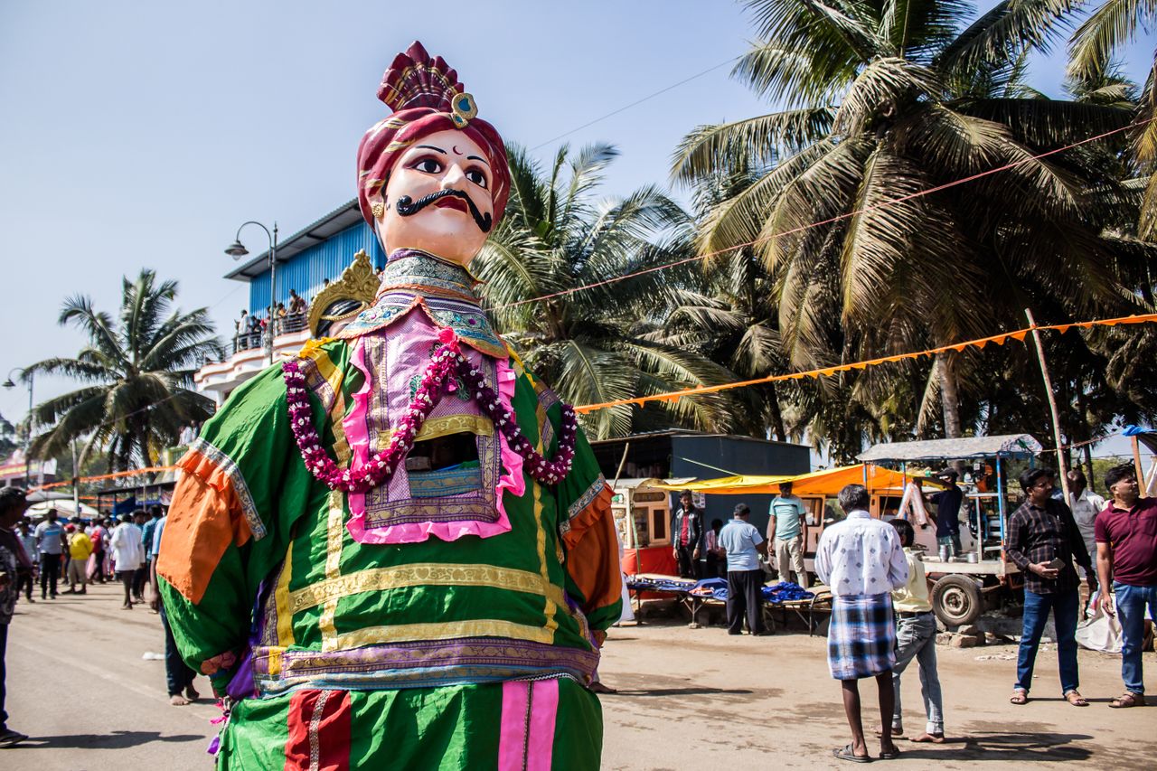 vibrant indian festival showcasing a colorful giant puppet and lively