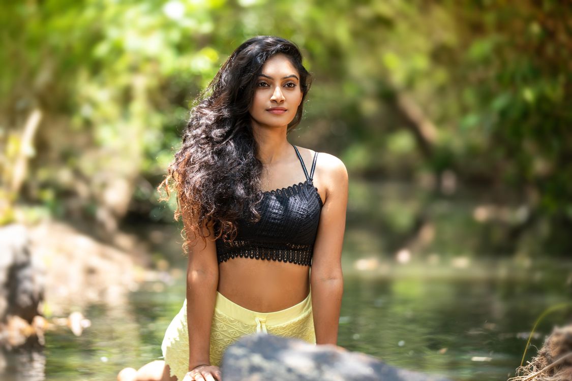 Young Woman Relaxing in Tranquil Outdoor Setting · Free Stock Photo