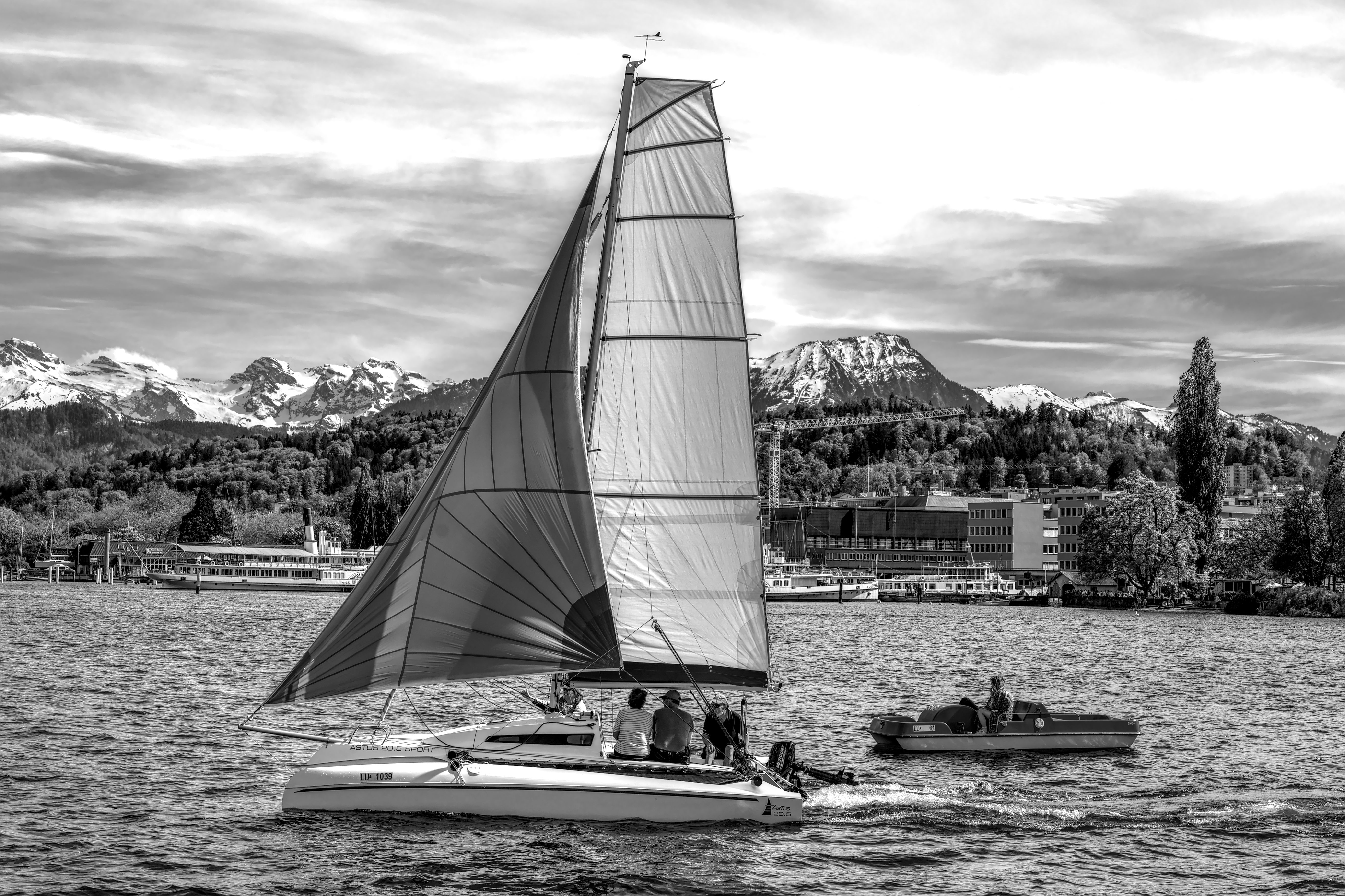 Scenic boat cruising on Lake Lucerne with mountains in the background, Switzerland