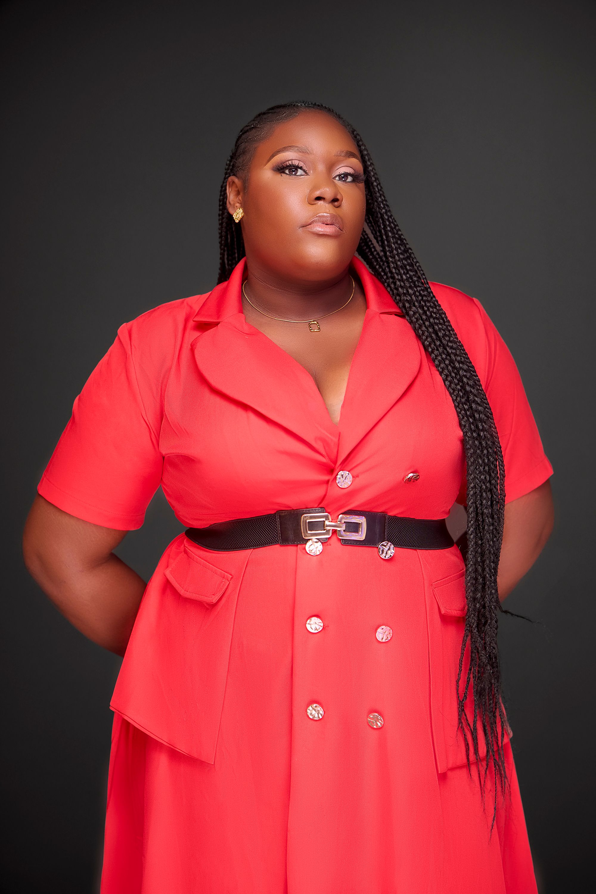 Confident Woman in a Red Dress Studio Portrait · Free Stock Photo
