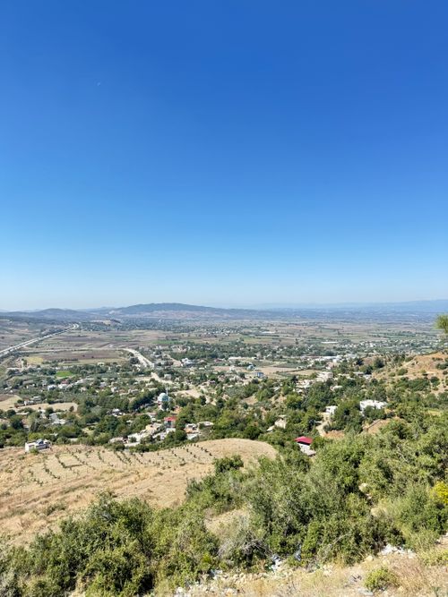 Free Aerial view of a vast countryside landscape with clear blue sky. Stock Photo
