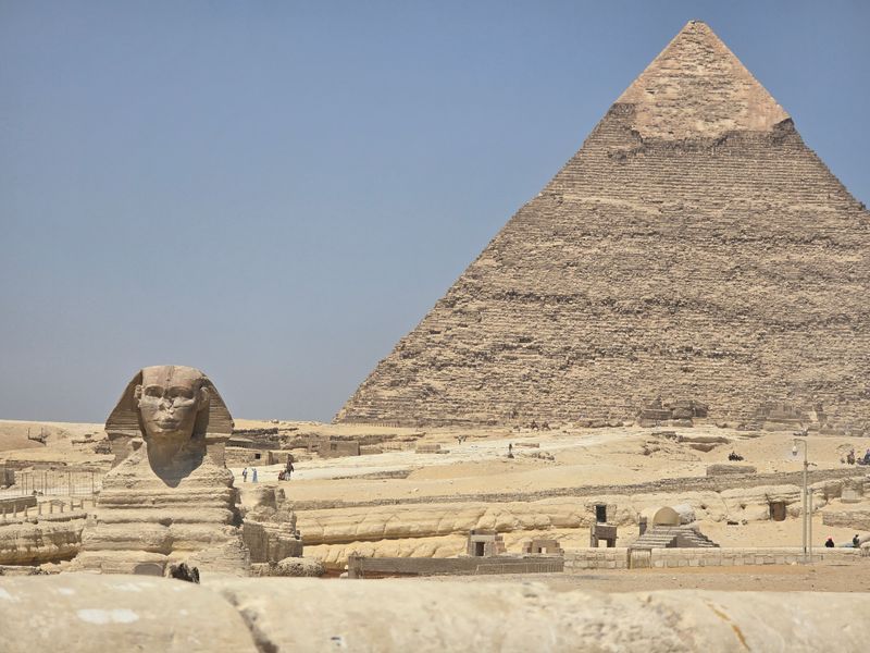 A View of the Great Sphinx of Giza beside a Pyramid · Free Stock Photo