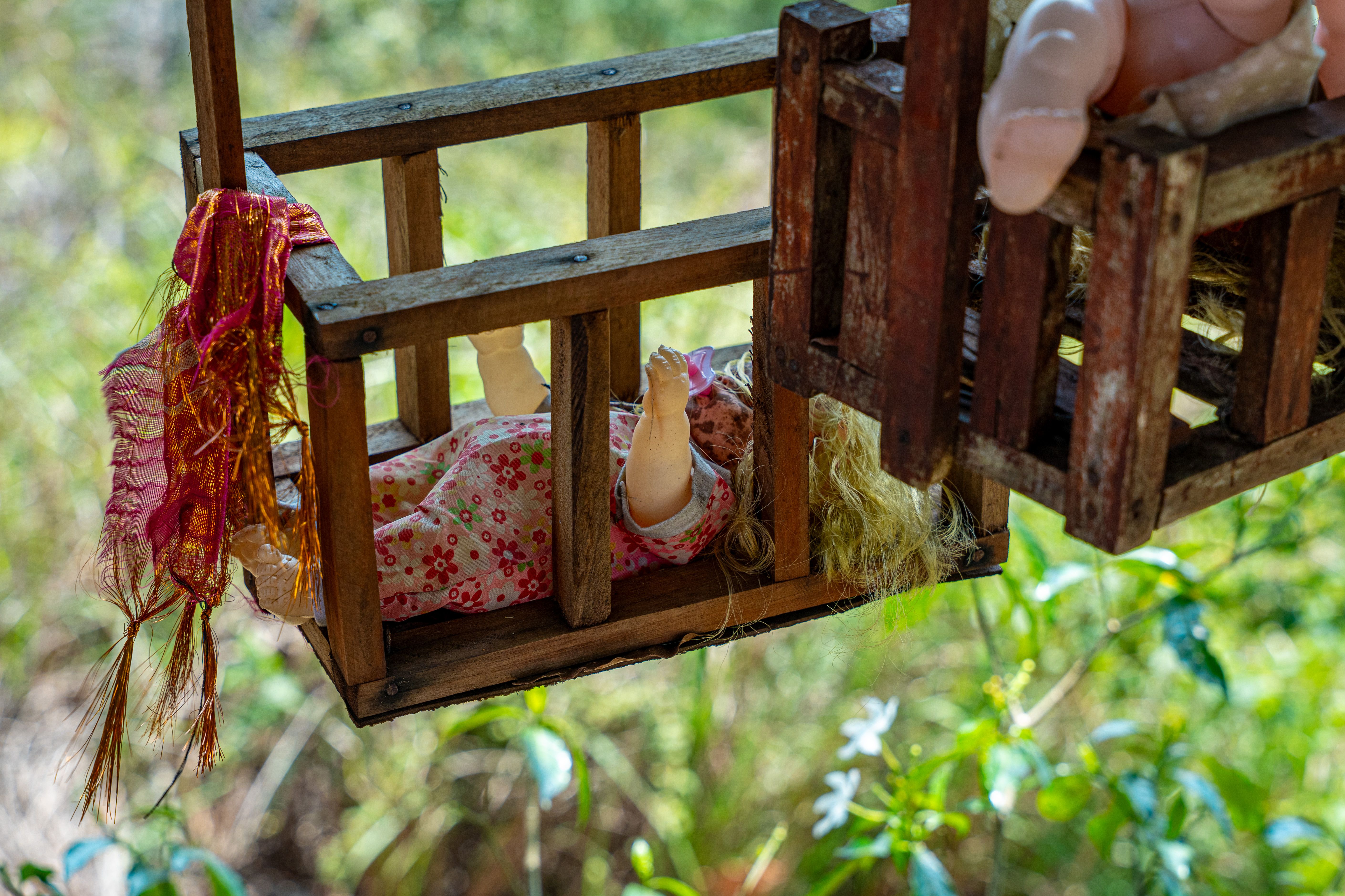 Traditional Hindu Ritual Doll in Wooden Cradle · Free Stock Photo