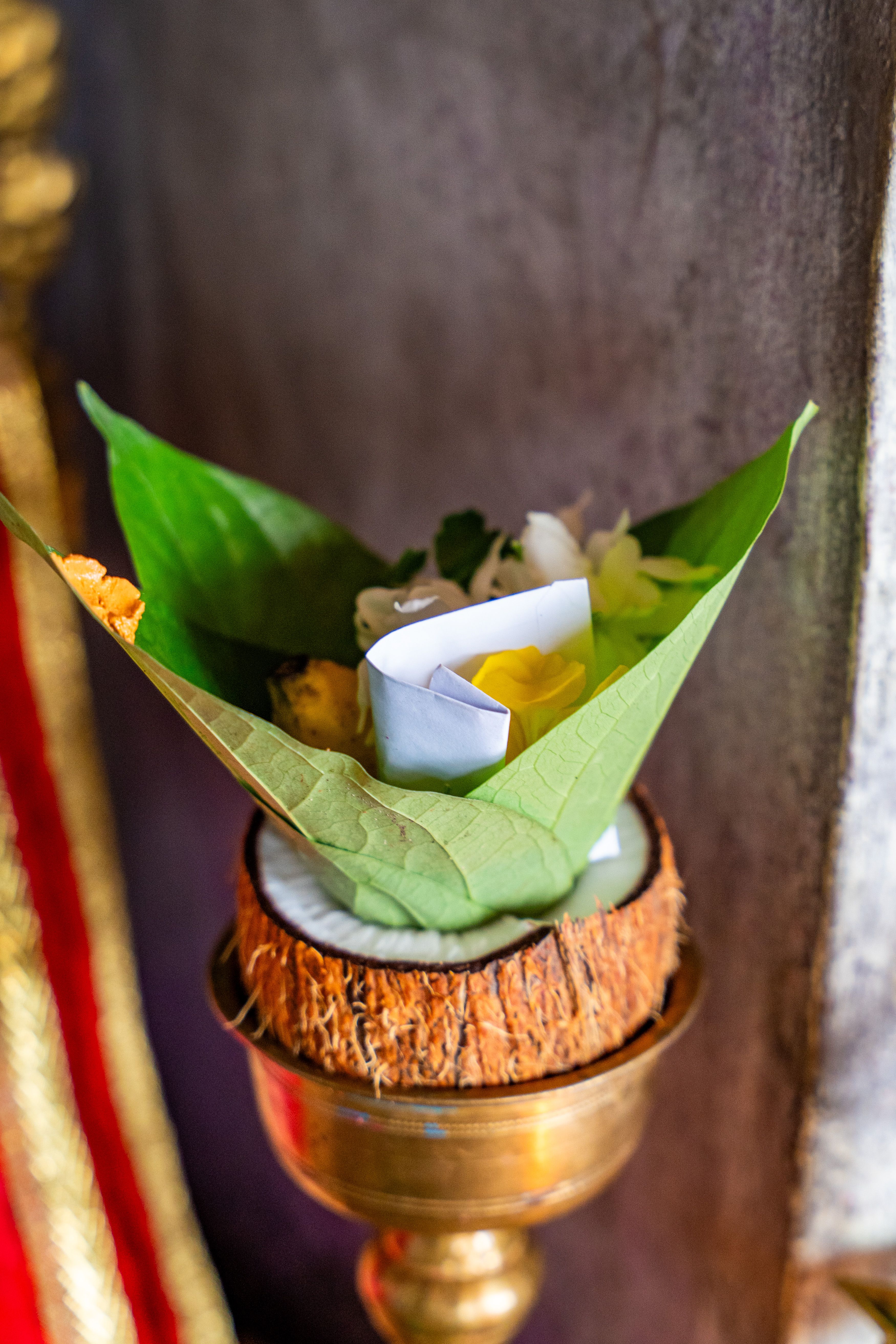 Colorful ceremonial offering with leaves and flowers in Vavuniya, symbolizing cultural traditions.