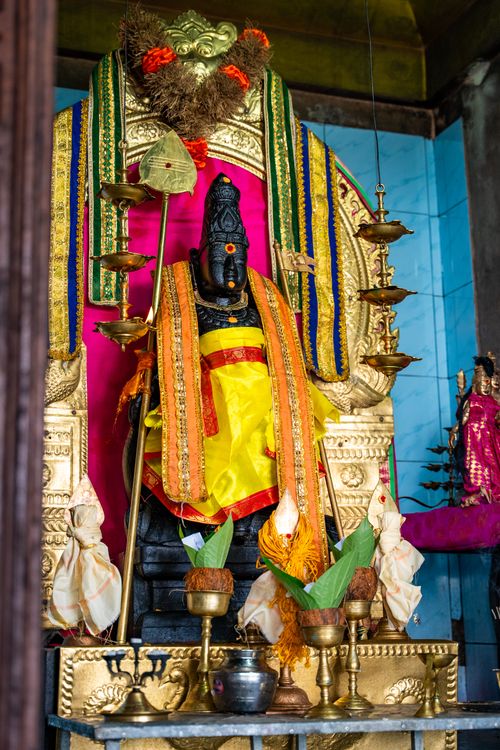 Free Intricate Hindu altar adorned with vibrant fabrics and traditional oil lamps in Vavuniya, Sri Lanka. Stock Photo