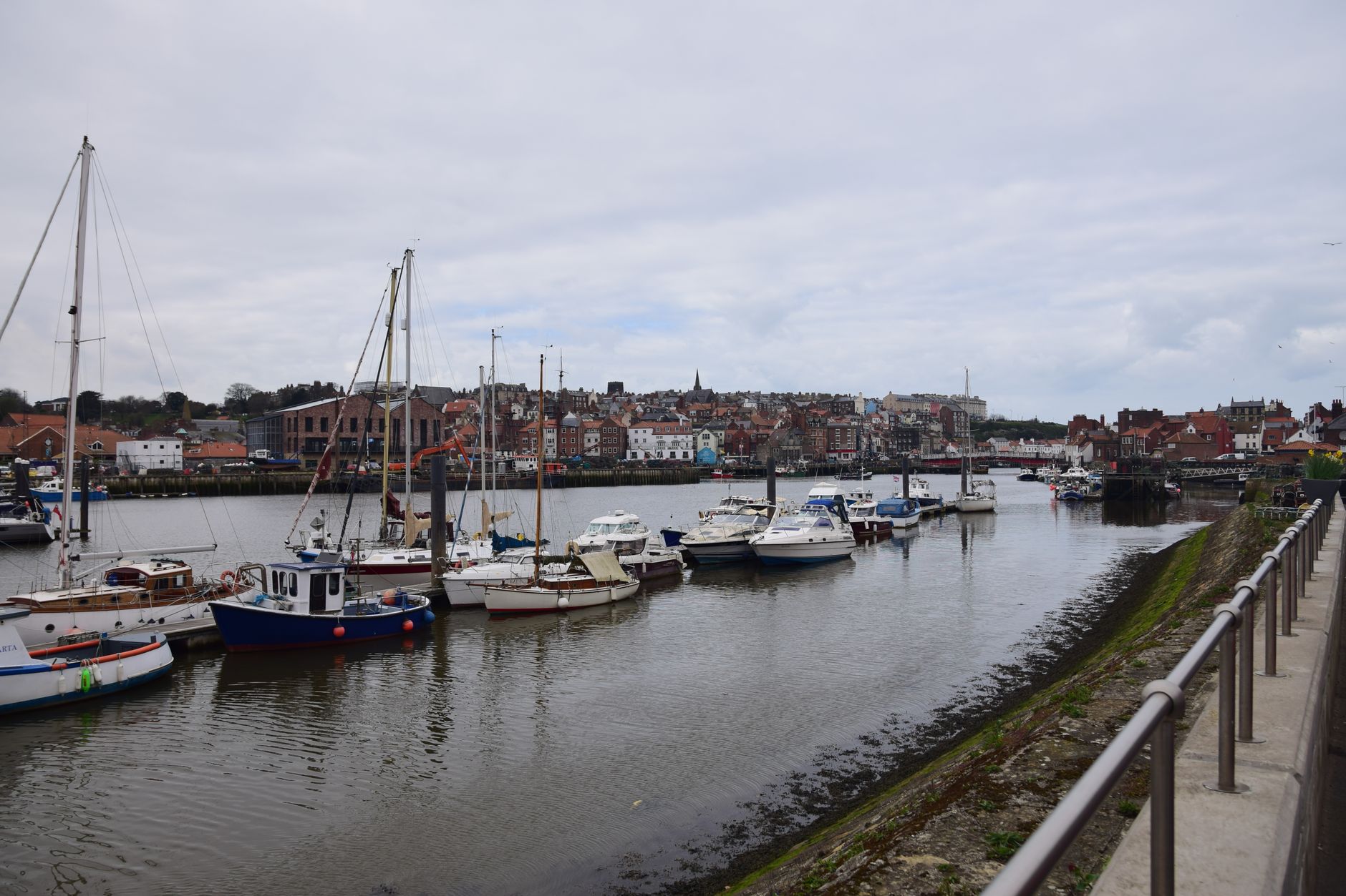 Charming view of boats in Whitby Harbour, capturing the essence of this coastal town's beauty.