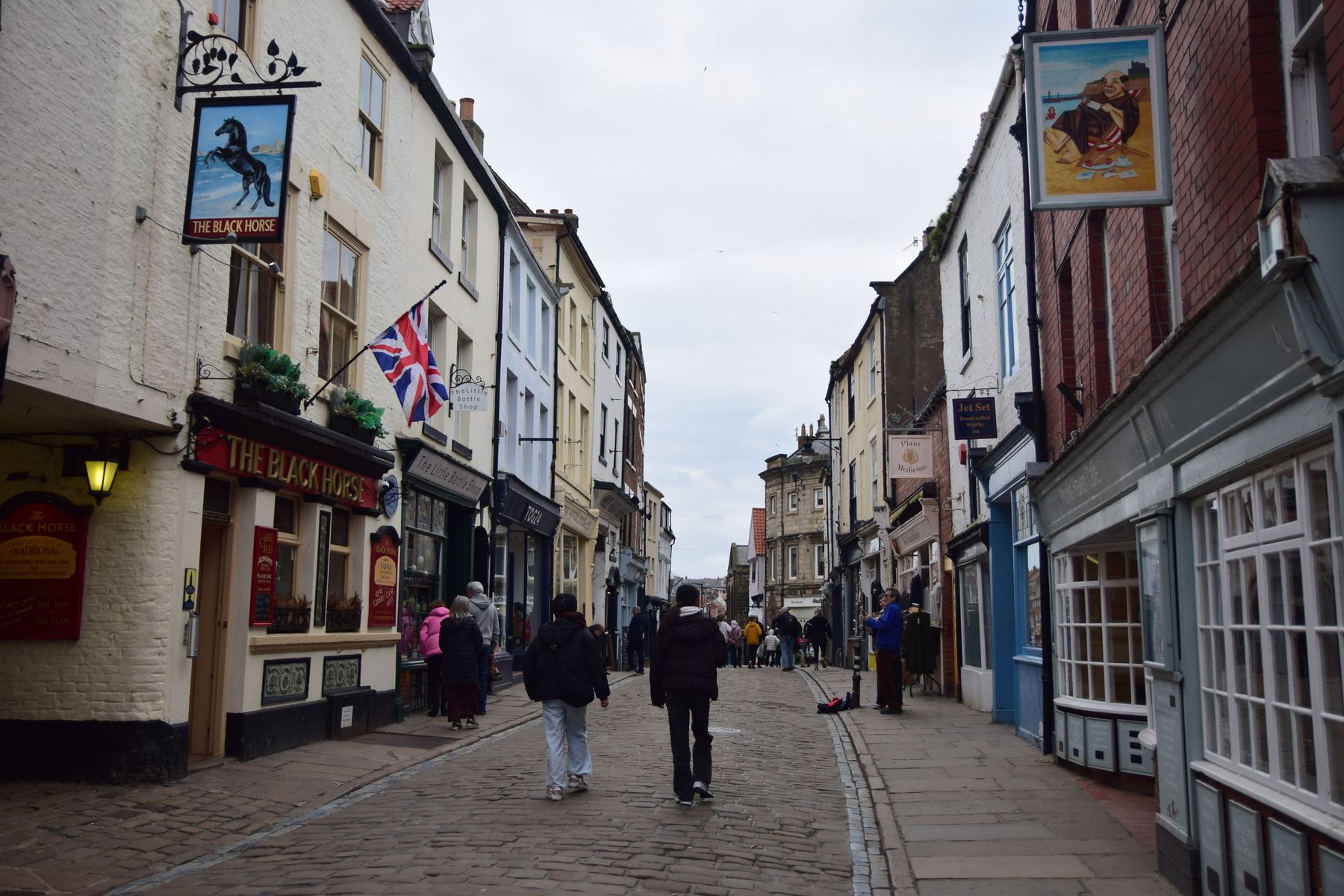 Market stalls and independent food shops on the marketplace in Malton, North Yorkshire