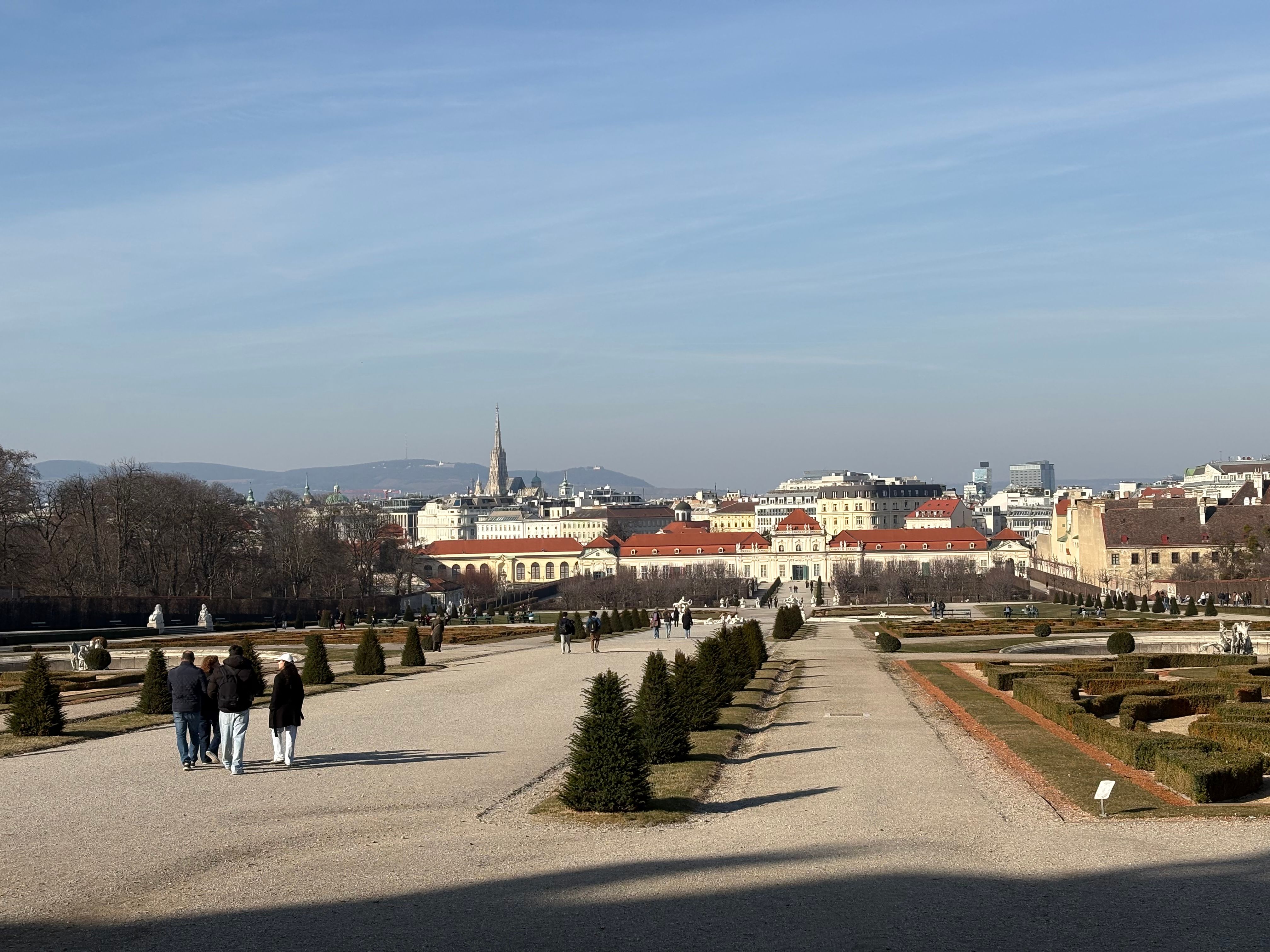 Free Stunning view of Belvedere Palace gardens with visitors strolling on a clear day. Stock Photo