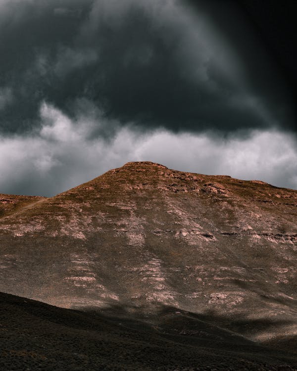 Free A Mountain Under Gray Clouds Stock Photo