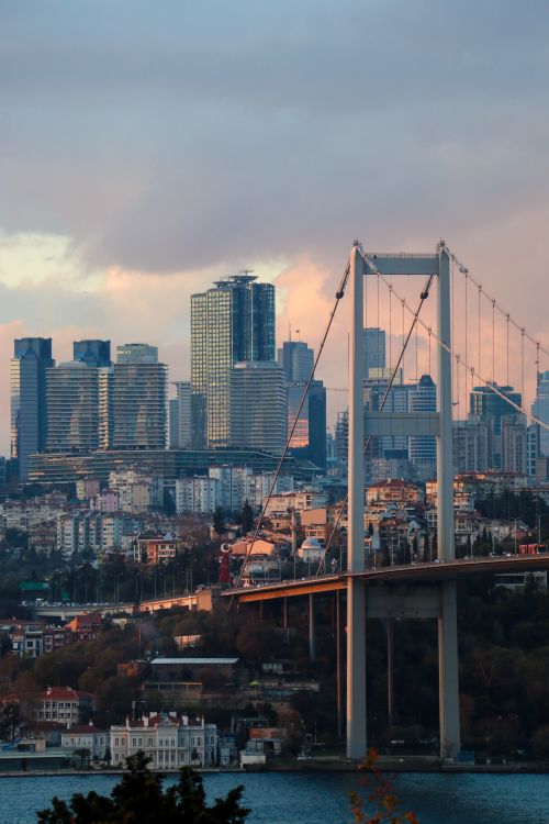 Free A stunning view of Istanbul's skyline with the Bosphorus Bridge at dusk, capturing urban beauty. Stock Photo