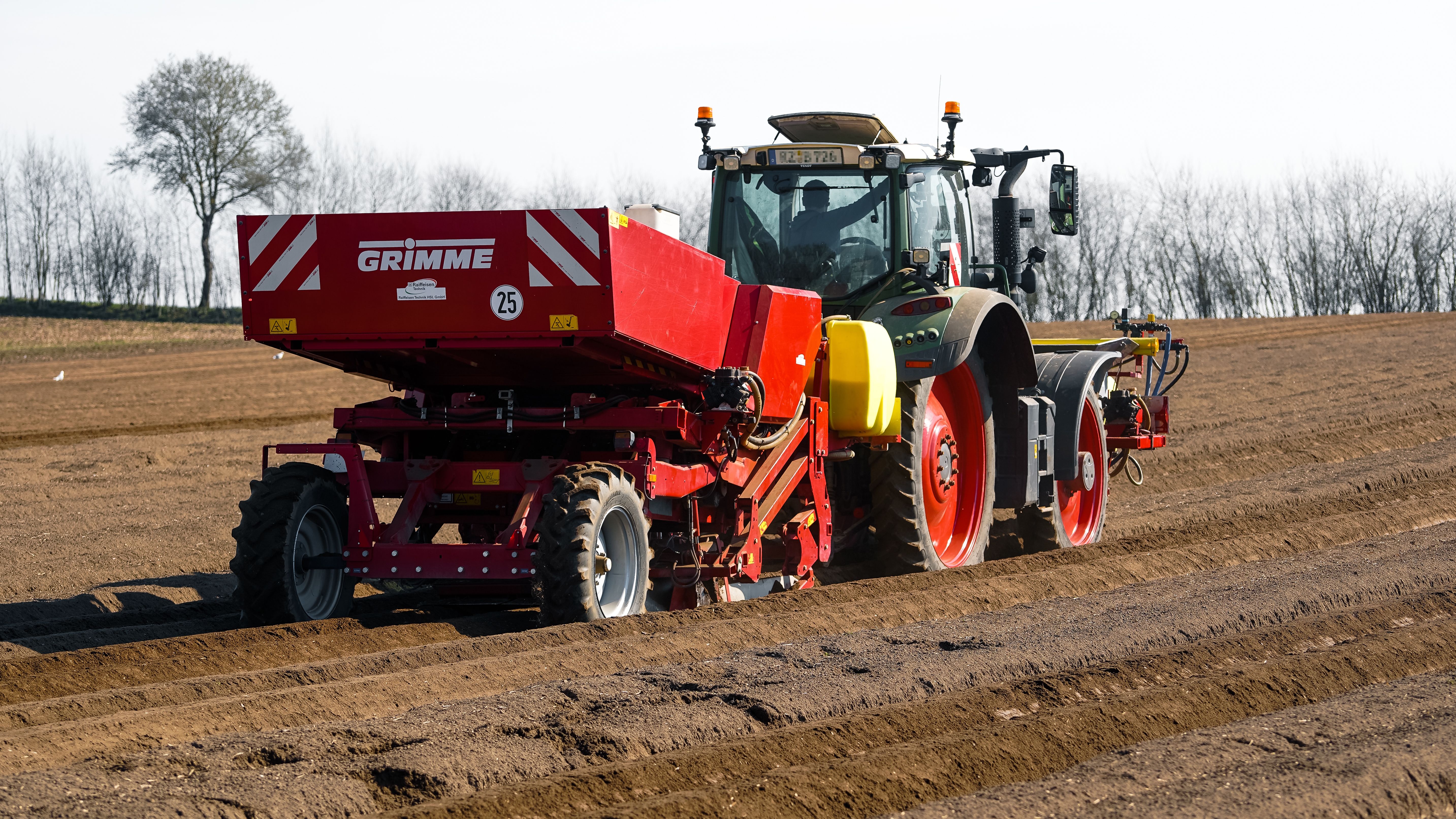 Modern Tractor Preparing Farmland for Spring Planting · Free Stock Photo