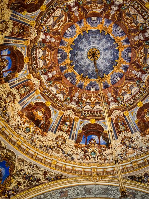 Free Stunning Rococo-style ceiling with ornate gold and blue detailing in a historic building. Stock Photo