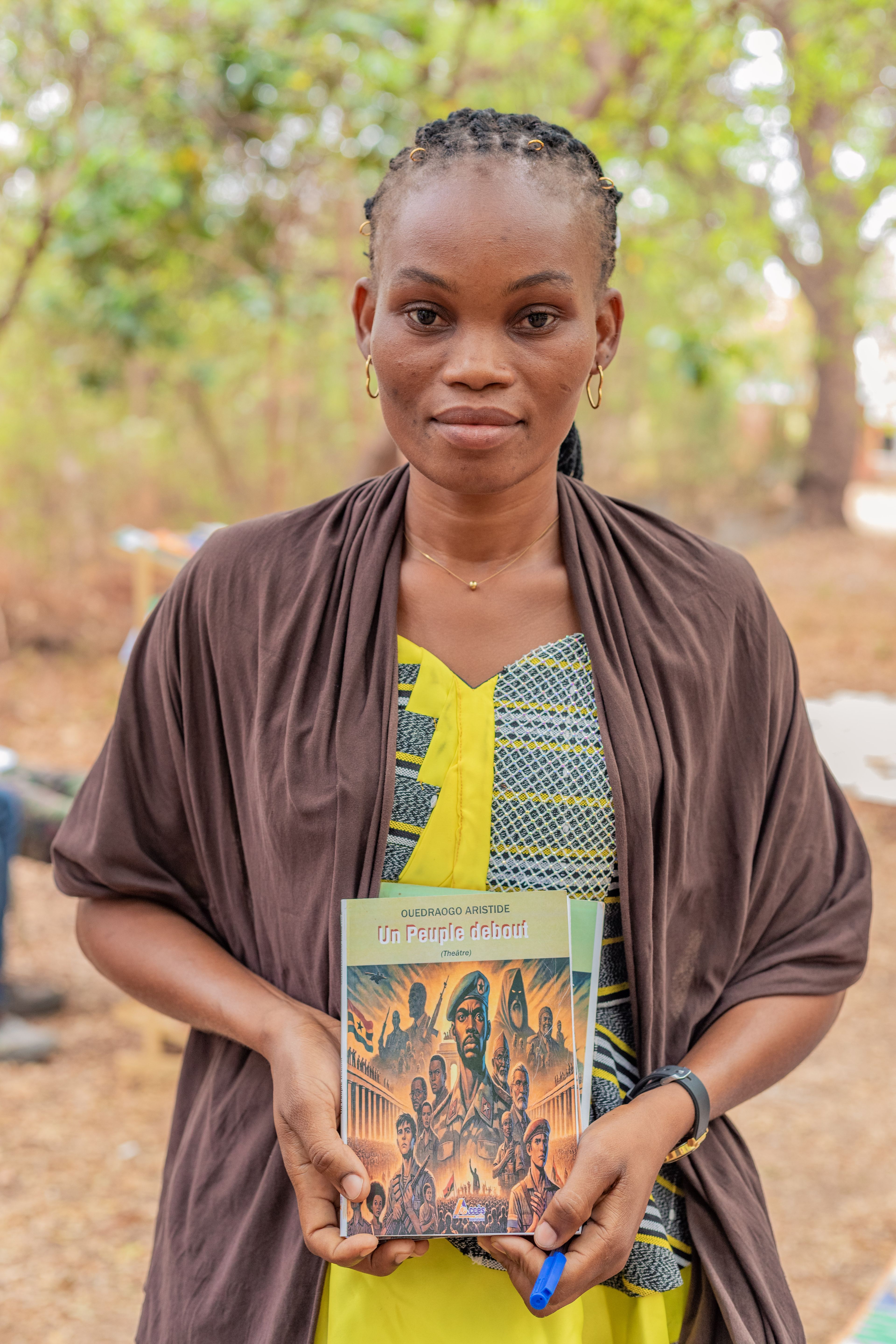 An author holding her book