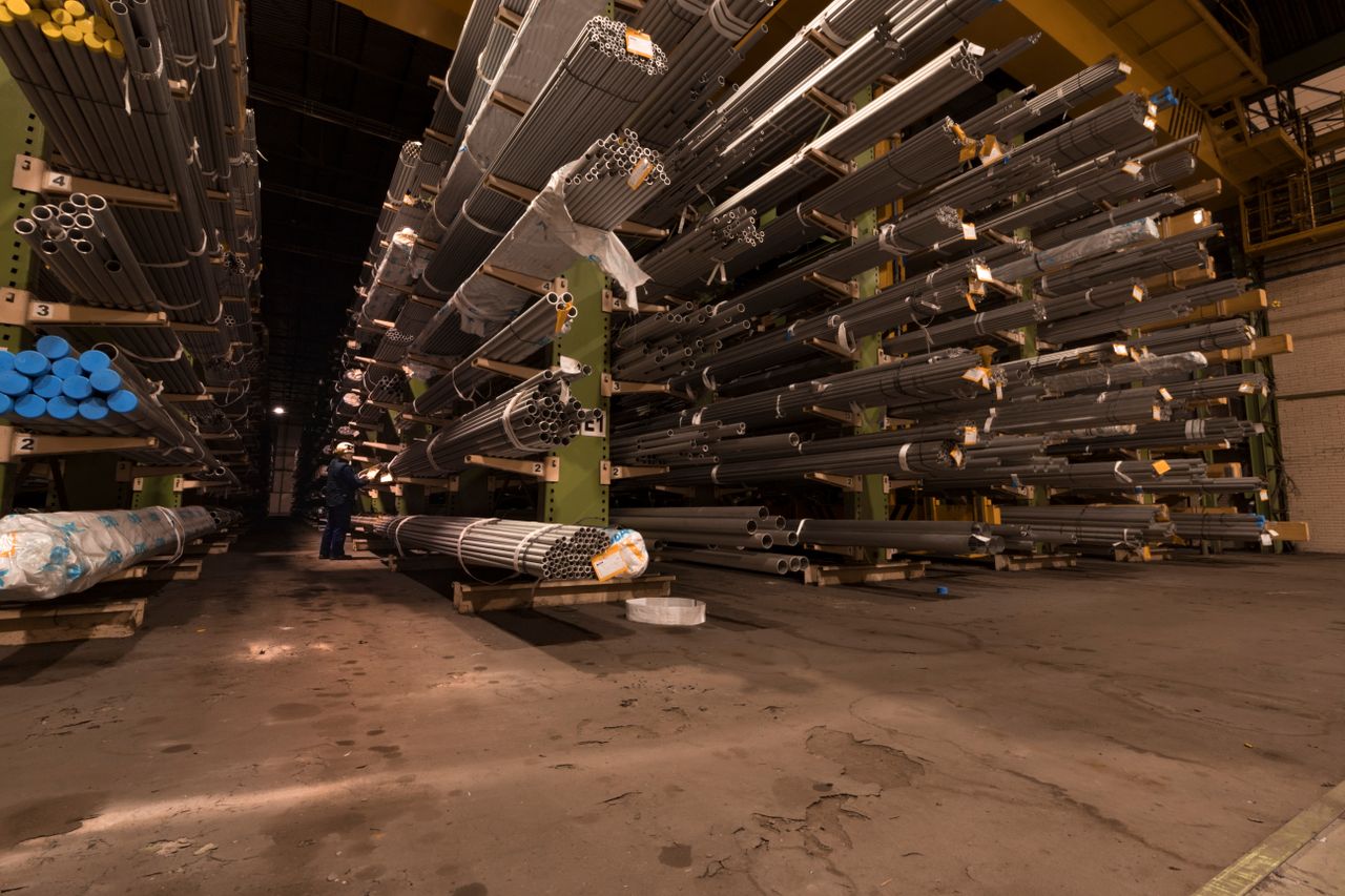 Industrial metal warehouse with steel pipe storage