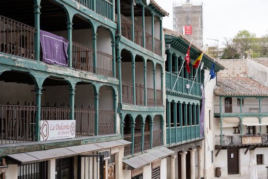 Traditional green wooden balconies at Plaza Mayor in Chinchón, Spain.