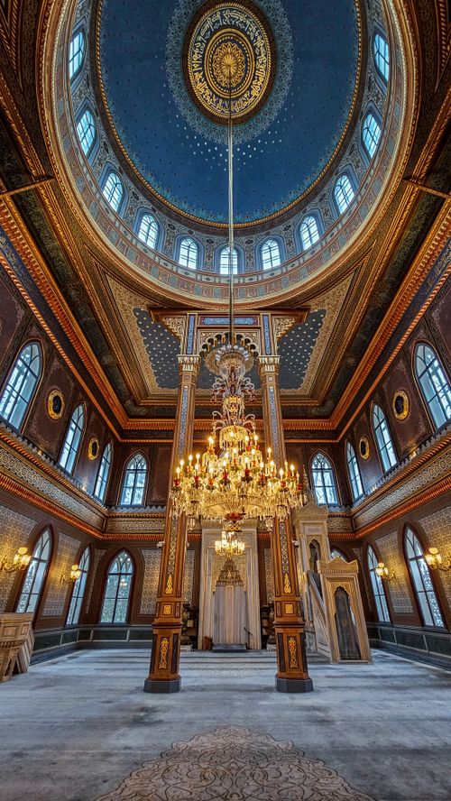 Free Stunning interior of a cathedral with intricate dome and elegant chandelier lighting. Stock Photo