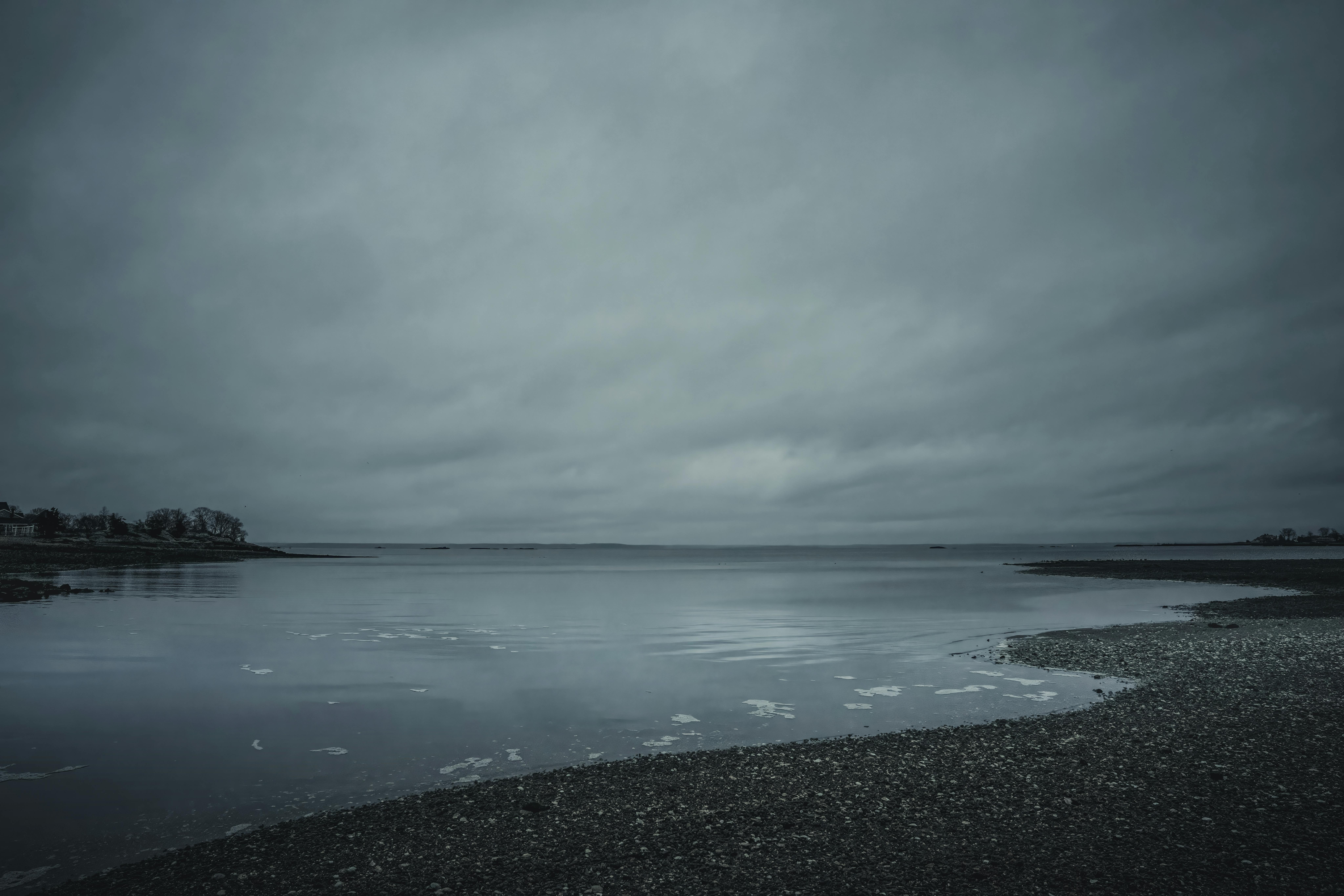 Serene view of an overcast sky over Cove Island Park's inlet in Stamford, Connecticut.