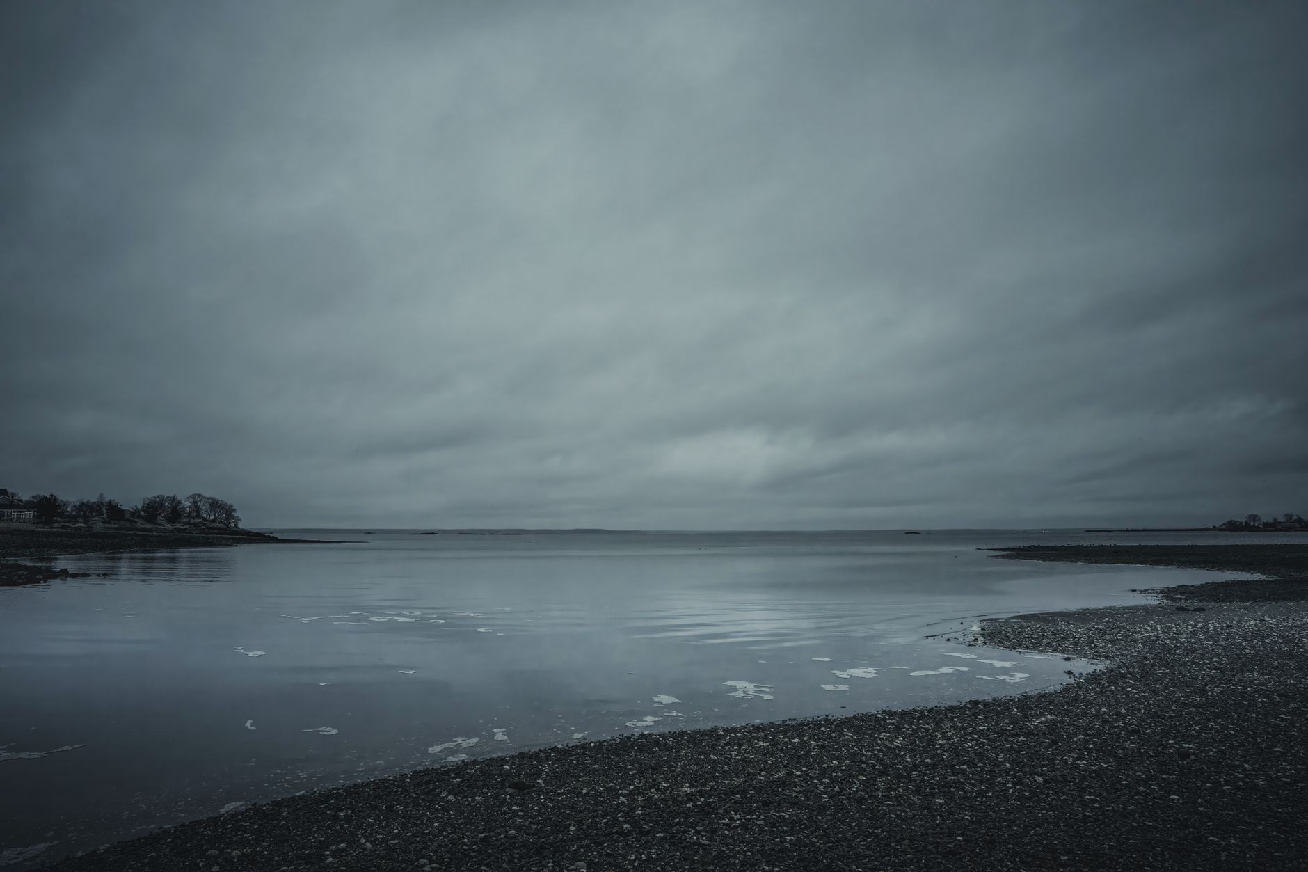 Serene view of an overcast sky over Cove Island Park's inlet in Stamford, Connecticut.
