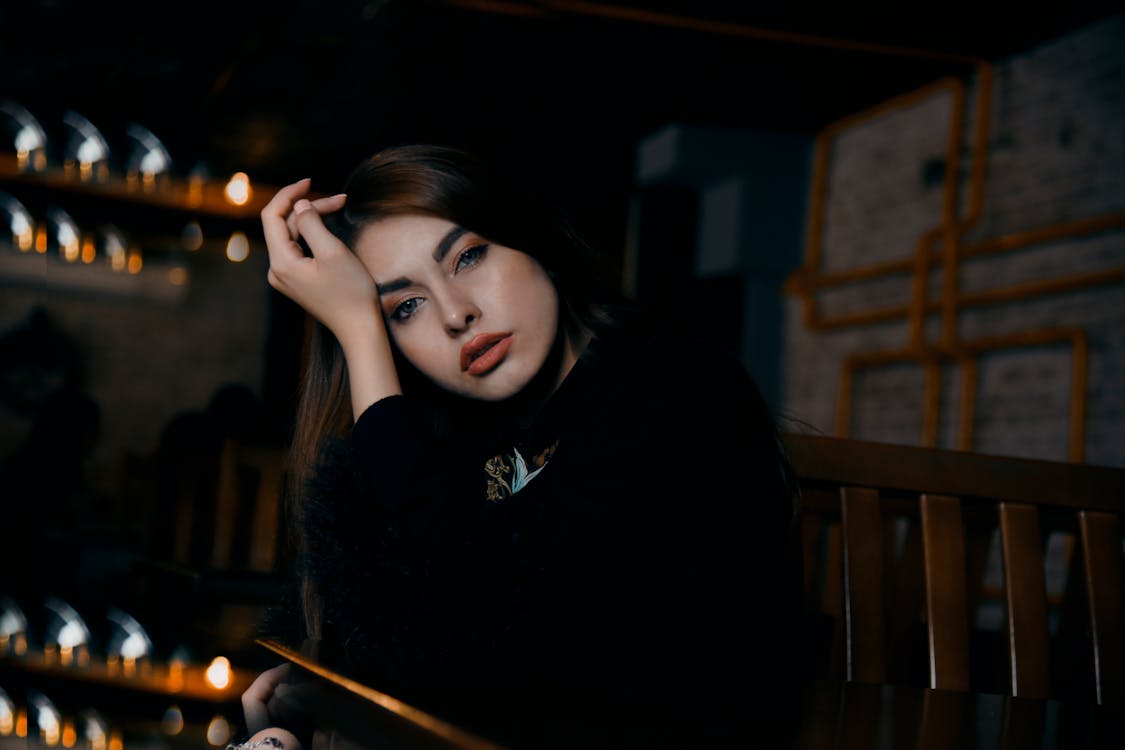 Photo Of Woman Wearing Black Sweater