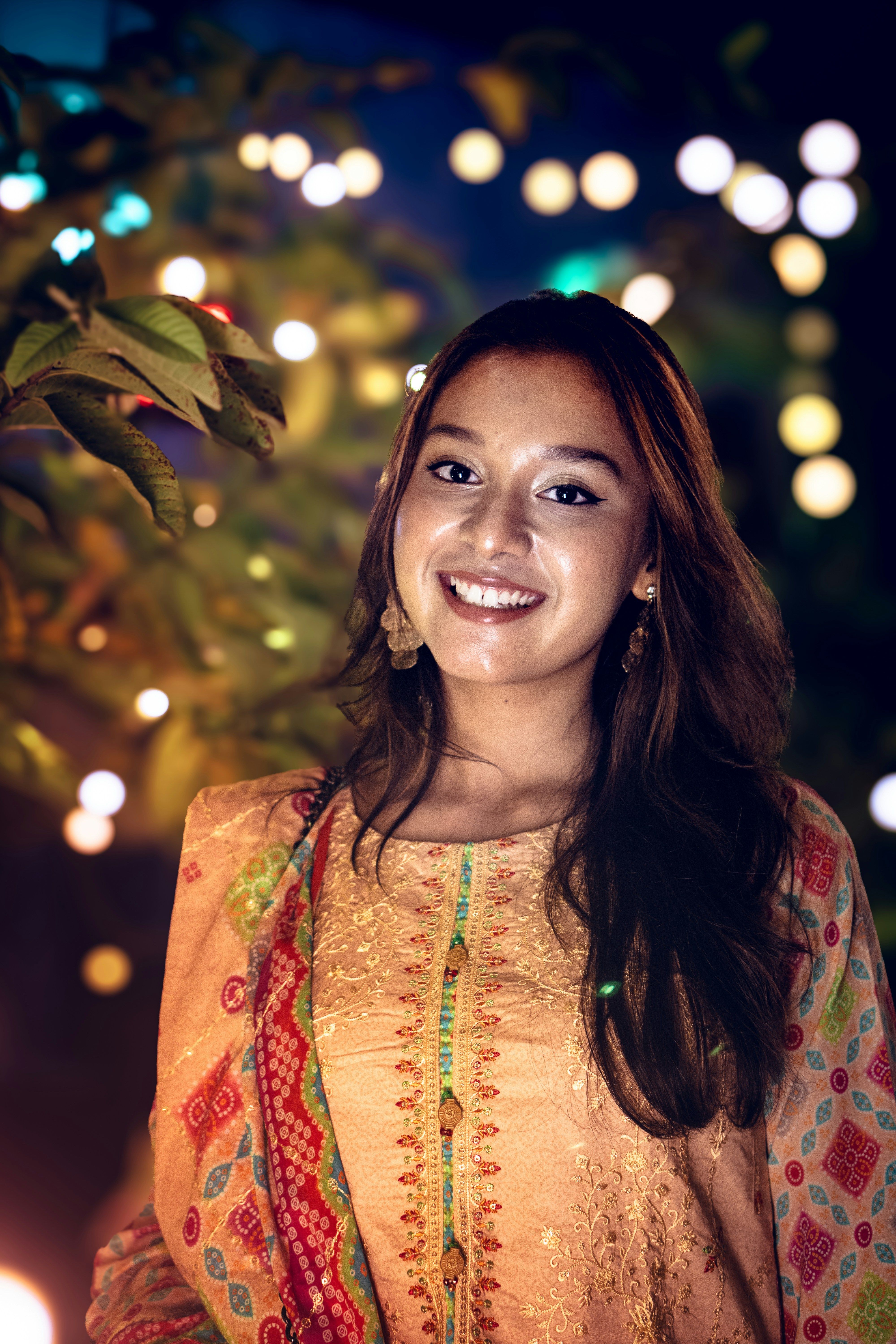 Smiling Woman in Traditional Festive Attire · Free Stock Photo