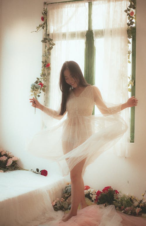 Photo Of Woman Wearing White See Through Dress