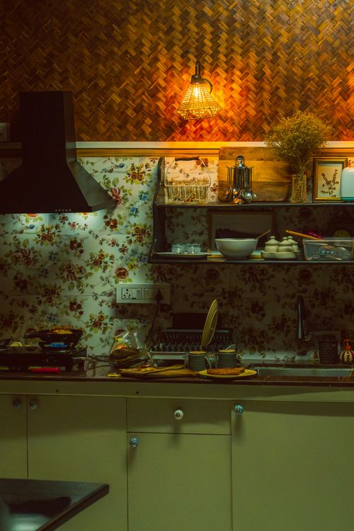 Free Warm and cozy kitchen setting with traditional decor and soft lighting in India. Stock Photo