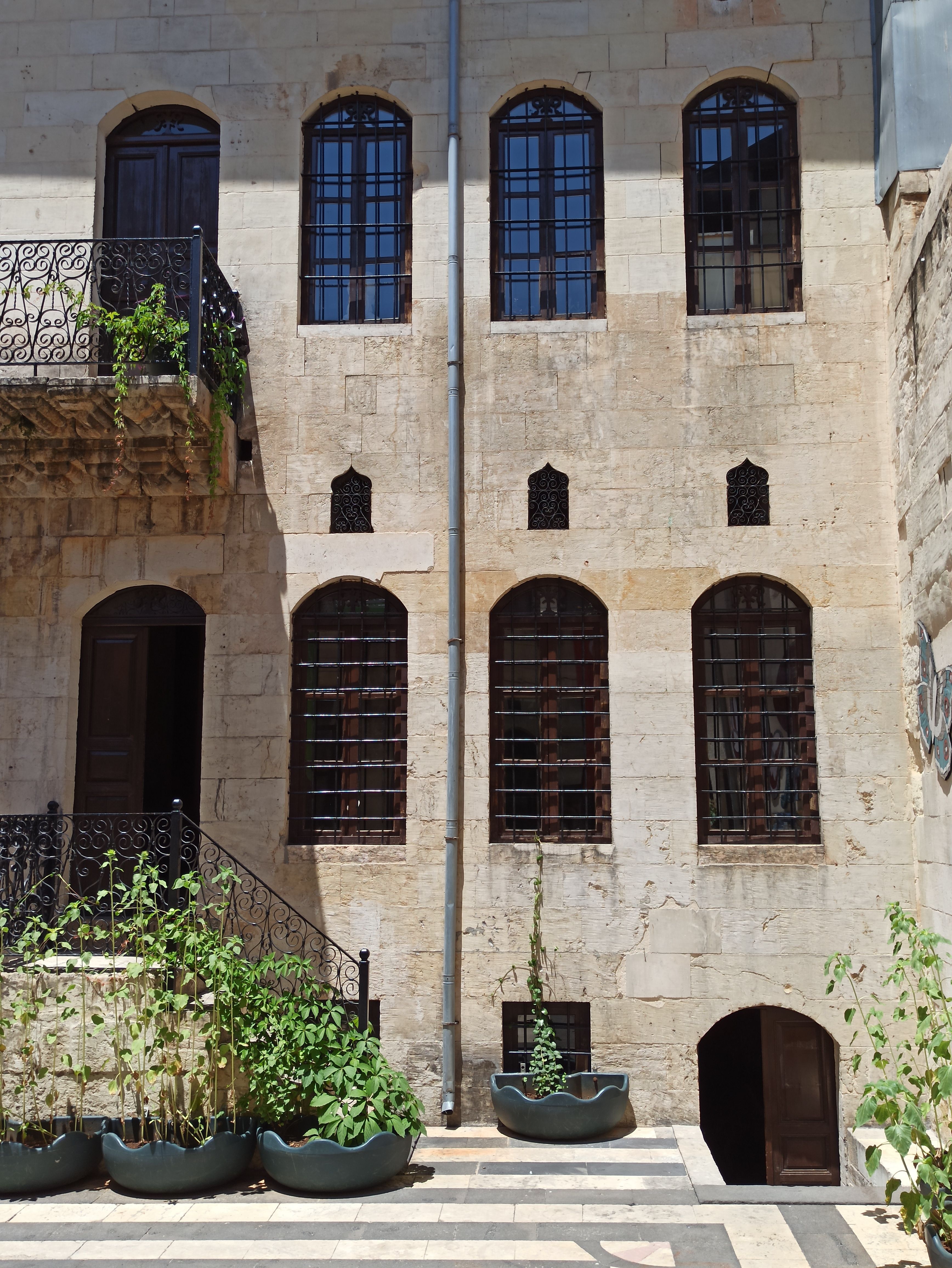 Historic Stone Building with Arched Windows · Free Stock Photo