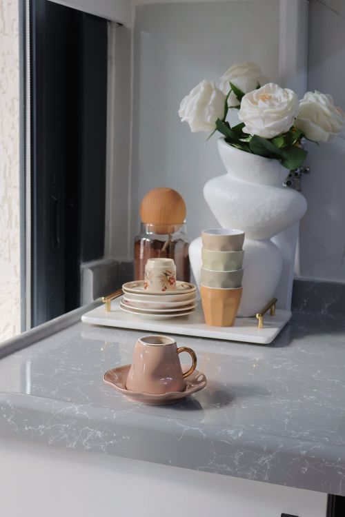 Free Aesthetic arrangement of coffee cups and decor on a modern kitchen counter. Stock Photo