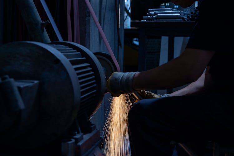 Man Grinding A Metal 