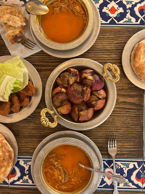 Free Aerial view of a traditional Turkish meal setup with soup, kebab, and salad. Stock Photo