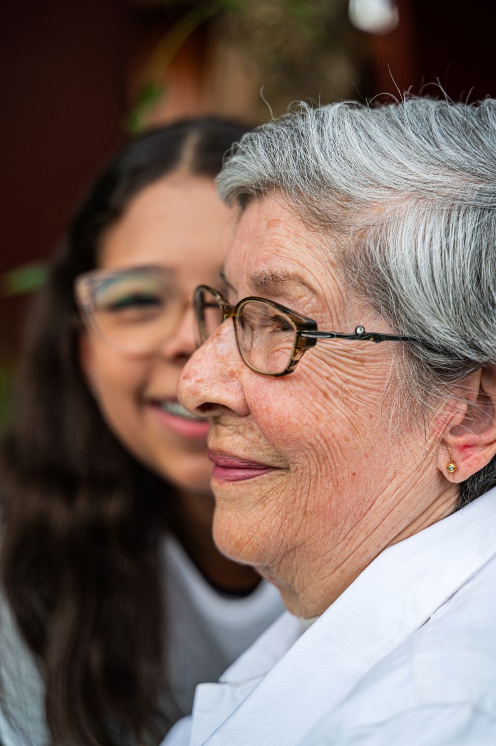 Smiling grandmother with her granddaughter