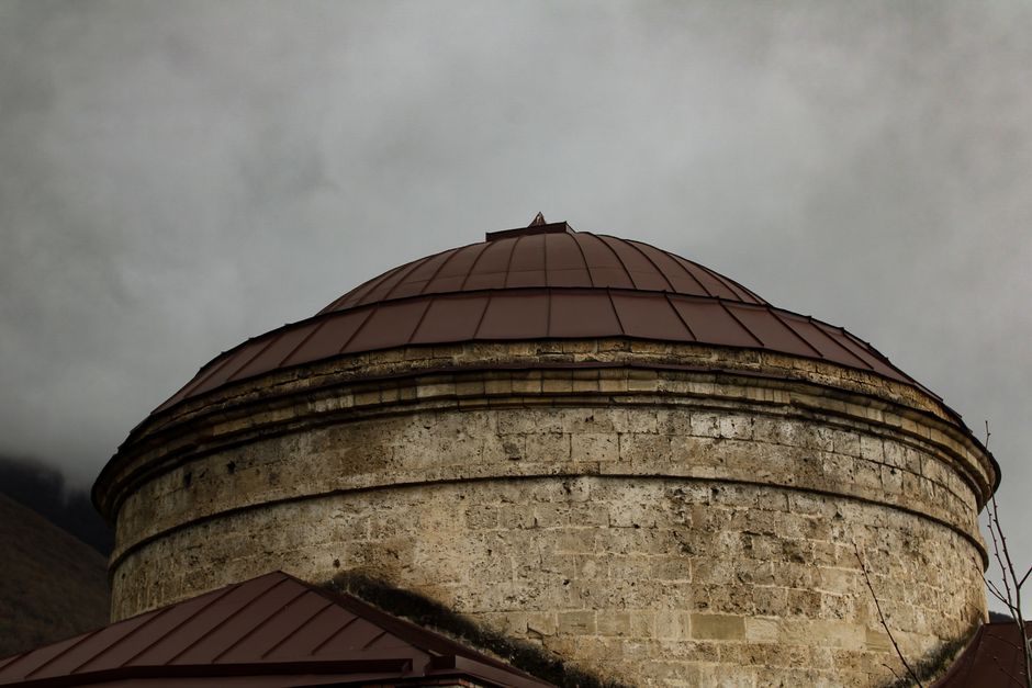 Captivating view of a rustic dome against moody skies.