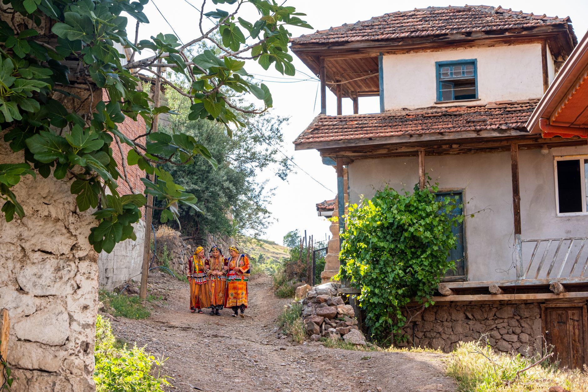 Rural village with locals in traditional attire in Sivas, Turkey.