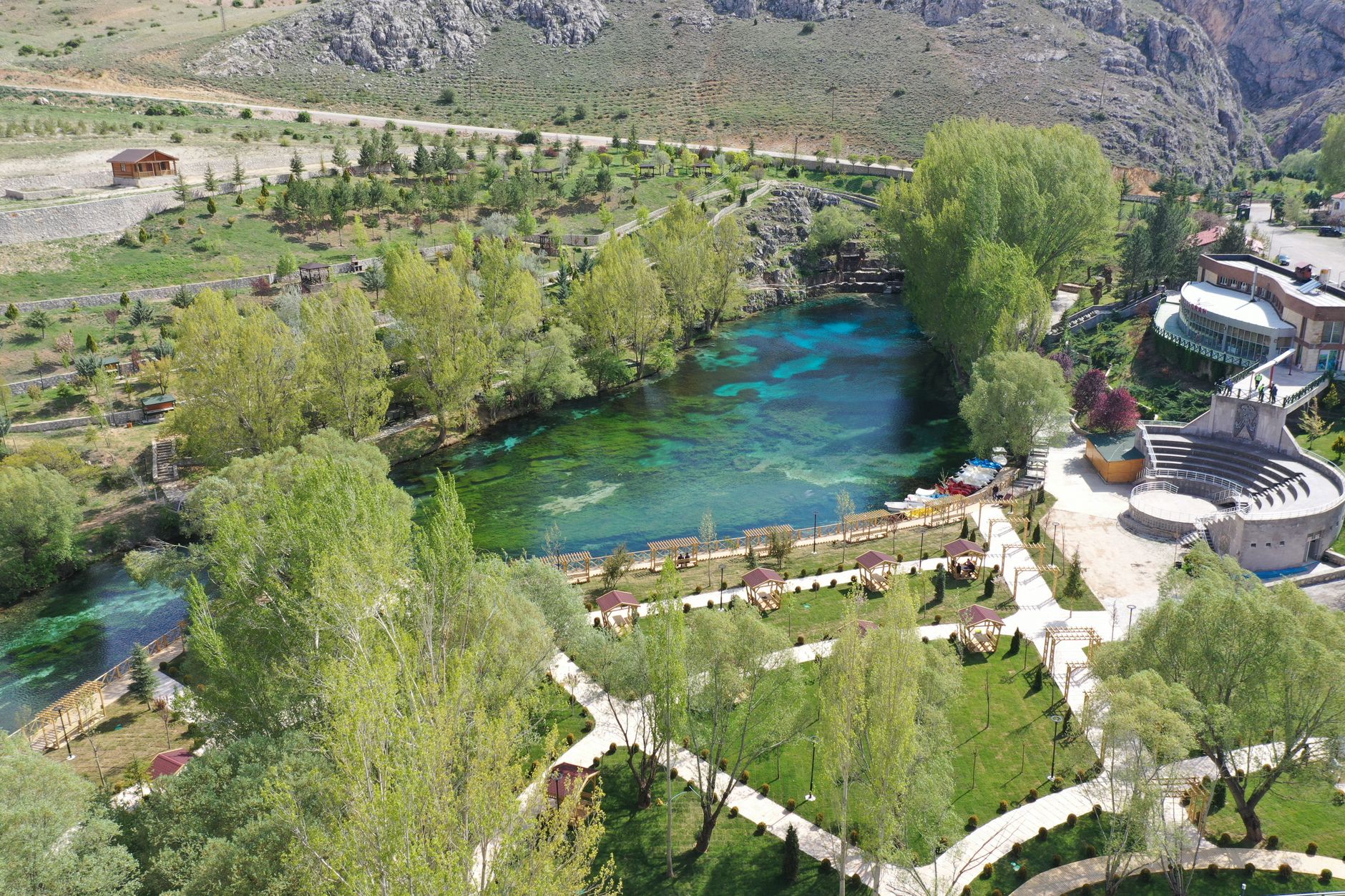 Beautiful aerial shot of a serene park with a clear blue lake in Sivas, Turkey.