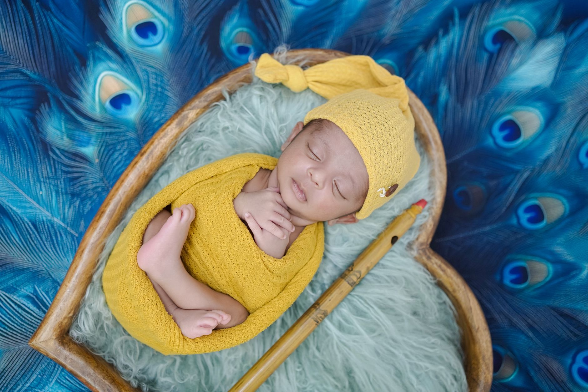 A mother and baby sleeping together in a bed